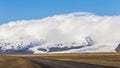 Icelandic ring road passing by Vatna Glacier VatnajÃÂ¶kull with clouds over mountains Royalty Free Stock Photo