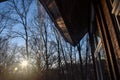 Icicle Hanging from the Roof with Sun shining.