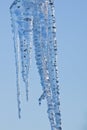 Icicle melting isolated against a blue sky