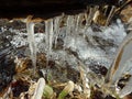 Icicle over stream Royalty Free Stock Photo