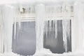 Icicle windows on winter time. Freeze temperatures backgrounds