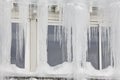 Icicle windows on winter time. Freeze temperatures backgrounds Royalty Free Stock Photo