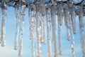 Icicles on the background of the blue sky Royalty Free Stock Photo
