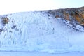 Icicles background on the ice wall on Baikal lake at winter