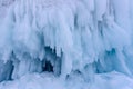 Icicles background on the ice wall on Baikal lake at winter