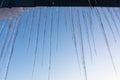 Icicles on blue sunset sky background Royalty Free Stock Photo