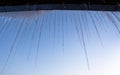 Icicles on blue sunset sky background Royalty Free Stock Photo