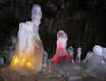 Icicles in a cave illuminated in color