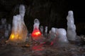 Icicles in a cave illuminated in color