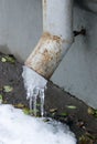 Icicles on a drainpipe in early winter Royalty Free Stock Photo
