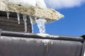 Icicles on the eaves of a house Royalty Free Stock Photo