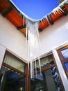 Icicles formed on an eaves of a house in winter