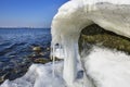 Icicles and frozen rocks on the Baltic Sea. Beautiful winter landscape Royalty Free Stock Photo