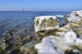 Icicles and frozen rocks on the Baltic Sea. Beautiful winter landscape Royalty Free Stock Photo