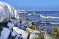 Icicles and frozen rocks on the Baltic Sea. Beautiful winter landscape Royalty Free Stock Photo