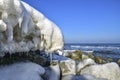 Icicles and frozen rocks on the Baltic Sea. Beautiful winter landscape Royalty Free Stock Photo