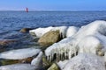 Icicles and frozen rocks on the Baltic Sea. Beautiful winter landscape Royalty Free Stock Photo