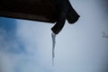 Icicles at gutter, blue sky Royalty Free Stock Photo