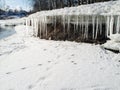 Icicles hang from a block of ice in the spring thaw Royalty Free Stock Photo