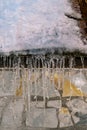 Icicles hang from the snow-covered roof of a house Royalty Free Stock Photo