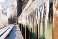 Icicles hang on the wall after an ice storm