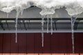 Icicles hanging from house eaves, Finland Royalty Free Stock Photo