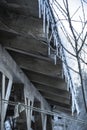 Icicles hanging on an old cottage roof Royalty Free Stock Photo
