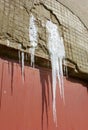 Icicles hanging over a door Royalty Free Stock Photo
