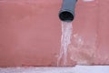 Icicles hanging on the pipe, the concept of winter Royalty Free Stock Photo