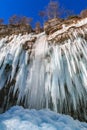 Icicles hanging from rock by the Pericnik waterfall Royalty Free Stock Photo