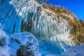 Icicles hanging from rock by the Pericnik waterfall Royalty Free Stock Photo