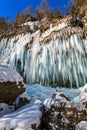 Icicles hanging from rock by the Pericnik waterfall Royalty Free Stock Photo