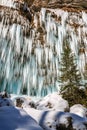 Icicles hanging from rock by the Pericnik waterfall Royalty Free Stock Photo