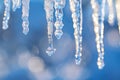 Icicles hanging from a roof frozen water drips forming beautiful ice structures Royalty Free Stock Photo