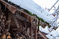 Icicles Hanging From A Roof. Roof Icicles. Spring Melting Snow.