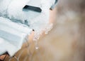 Icicles melt and drip in the Sun. Water drips from the roof. The snow melts in spring Royalty Free Stock Photo