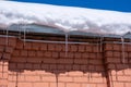 icicles and melting snow on the roof Royalty Free Stock Photo