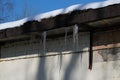 icicles and melting snow on the roof Royalty Free Stock Photo