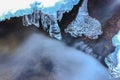 Icicles and milky stream Royalty Free Stock Photo