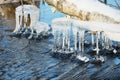Icicles over water Royalty Free Stock Photo