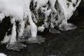 icicles are piled up over the water on a mountain stream Royalty Free Stock Photo