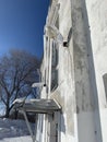 Home lined with icicles in winter