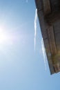 Icicles on the roof in early spring. The suckers hanging on the roof of the house melt in the sun Royalty Free Stock Photo