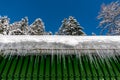 Icicles on the roof of the house Royalty Free Stock Photo