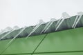 Icicles on roof. Ice on building. Icing of visor. Melting snow Royalty Free Stock Photo