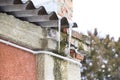 Icicles on the roof. Insecure roof. Freezing water in the icicle. Royalty Free Stock Photo