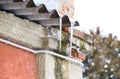 Icicles on the roof. Insecure roof. Freezing water in the Royalty Free Stock Photo