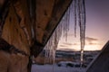 Icicles on the roof of wooden Hut Royalty Free Stock Photo