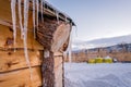 Icicles on the roof of wooden Hut Royalty Free Stock Photo