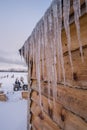 Icicles on the roof of wooden Hut Royalty Free Stock Photo